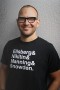 Cory Doctorow wearing "Ellsberg & Nikitin & Manning & Snowden" tshirt