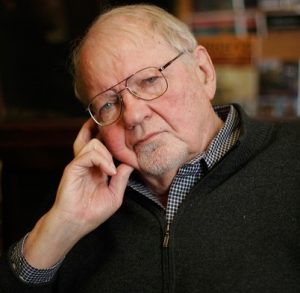 headshot of Fredric Jameson, with chin on hand